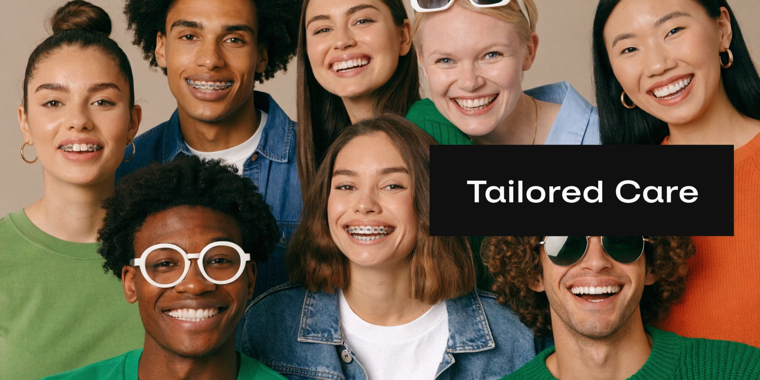 A diverse group of smiling people with healthy teeth, some wearing braces, smiling towards the camera.