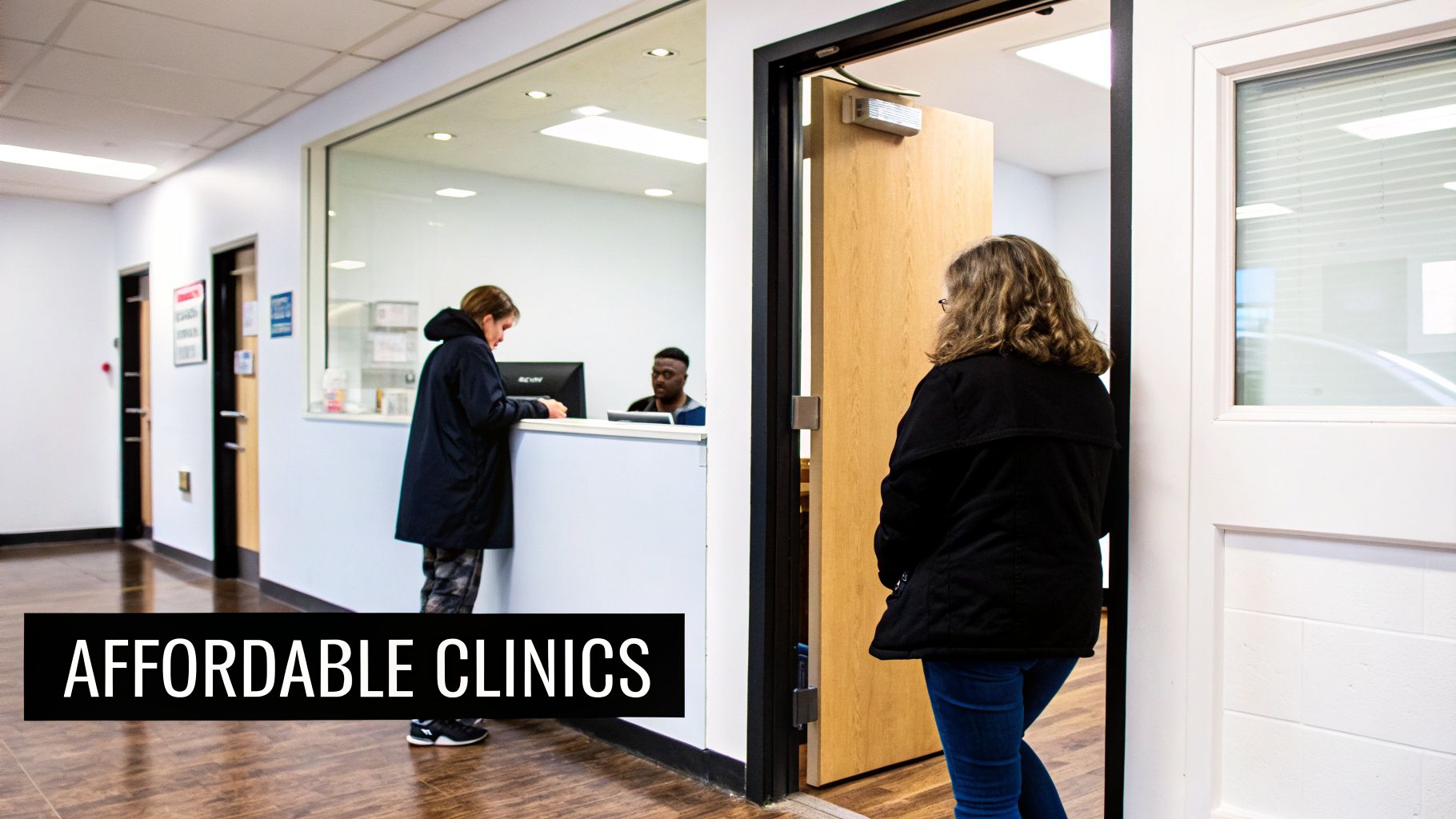 People interacting at a reception desk and entering a room in what appears to be an affordable clinic.